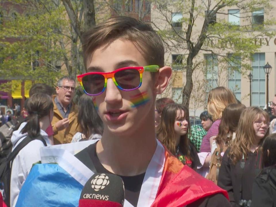 Logan Martin, a Grade 11 student at Saint John High School, was part of a protest against reviewing a policy designed to protects LGBTQ students.   (Graham Thompson/CBC - image credit)