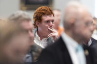 Buster Murdaugh, the son of Alex Murdaugh, listens as his father, Alex Murdaugh, testifies in his own trial for murder at the Colleton County Courthouse on Thursday, Feb. 23, 2023 in Walterboro, S.C. (Joshua Boucher/The State via AP, Pool)