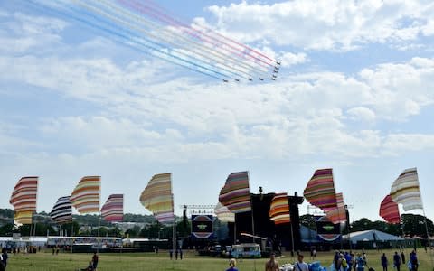 The Red Arrows perform a flypast over the Over Stage on Saturday morning - Credit: &nbsp;Leon Neal/&nbsp;Getty Images Europe