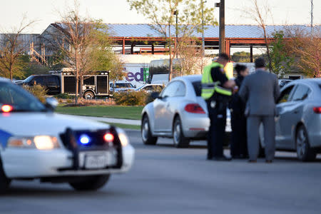 Schertz Police block off Doerr Lane near the scene of a blast at a FedEx facility in Schertz, Texas, U.S., March 20, 2018. REUTERS/Sergio Flores