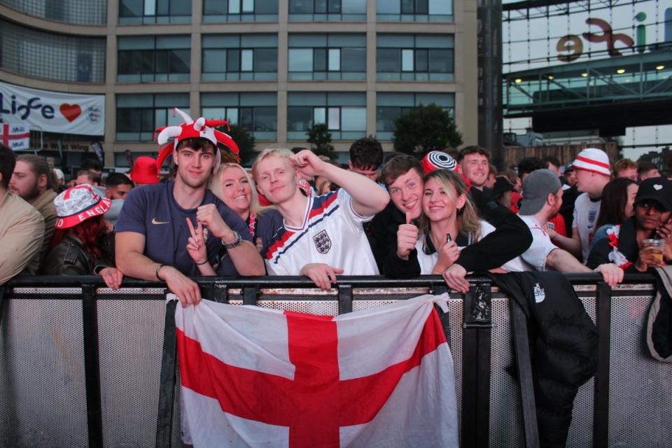 Kennedy Campbell (2L), 24, poses with her friends at the front of the standing crowd at Newcastle fan zone (Tom Watling)