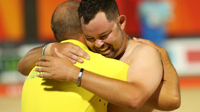 Wilson embraces his coach. Image: Getty