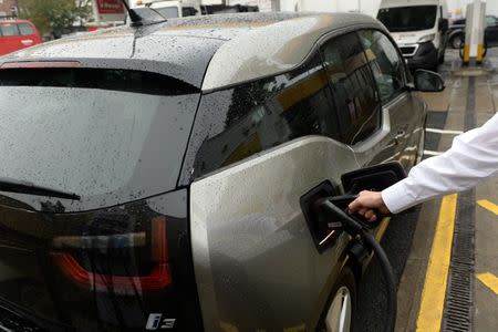 An electric car charges at the Holloway Road Shell station where Shell is launching its first fast electric vehicle charging station in London, Britain October 18, 2017. REUTERS/Mary Turner