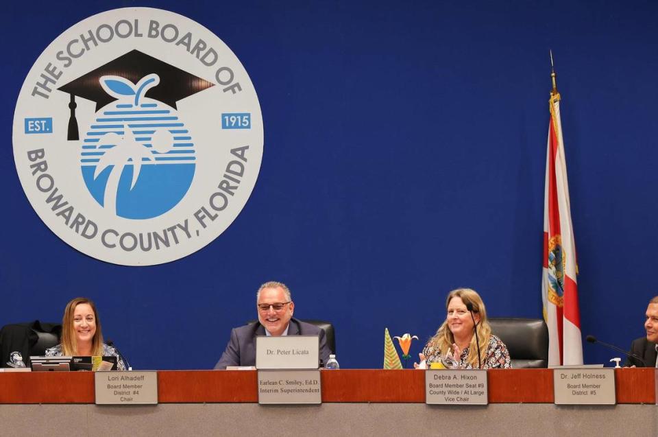 Superintendent Peter Licata takes his seat among Broward School Board members after his $350,000 annual contract was approved by the Broward School Board on Tuesday, July 11, 2023. Left to right: Lori Alhadeff, board chair; Licata, superintendent; Debra Hixon, vice chair; and Jeff Holness, board member.