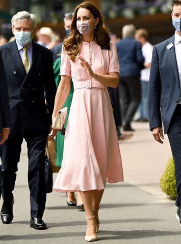 Karwai Tang/WireImage Kate Middleton attends Wimbledon in 2021 with her father Michael Middleton.