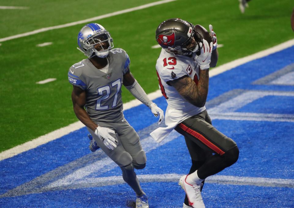 Tampa Bay Buccaneers receiver Mike Evans catches a touchdown pass against Detroit Lions cornerback Justin Coleman during the first half Saturday, Dec. 26, 2020 at Ford Field.