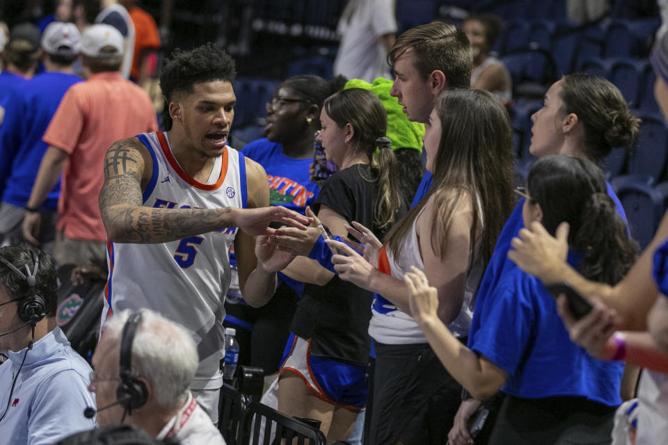 Florida guard Will Richard (5) celebrates beating Alabama after the second half of an NCAA college basketball game Tuesday, March 5, 2024, in Gainesville, Fla. (AP Photo/Alan Youngblood)