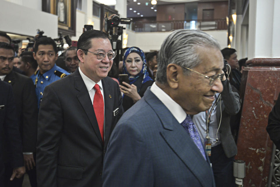 Finance Minister Lim Guan Eng and Prime Minster Tun Dr Mahathir Mohamad arrive in Parliament for the tabling of Budget 2020 on October 11, 2019. — Picture by Shafwan Zaidon