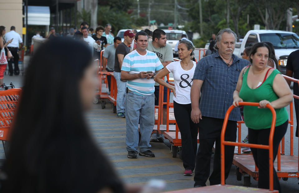 <p>People wait in line to purchase plywood at The Home Depot as they prepare for Hurricane Irma on September 6, 2017 in Miami, Fla. (Photo: Joe Raedle/Getty Images) </p>