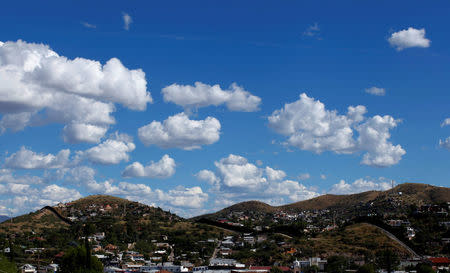 Clouds float above the border towns of Nogales, Mexico and Nogales, Arizona, United States, October 9, 2016. REUTERS/Mike Blake