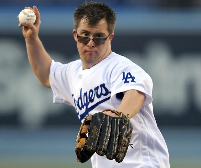 Joc Pederson’s brother, Champ, announced the Warriors starting lineup and assisted coach Steve Kerr on Special Needs Family Appreciation Night at Oracle Arena. (AP)