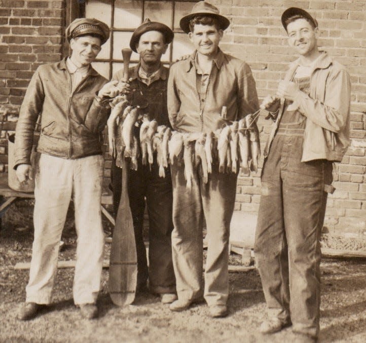 Annie D's husband, Pete Seagraves, third from left, poses with friends with a catch of  fish they caught in the Oconee River in the 1940s.