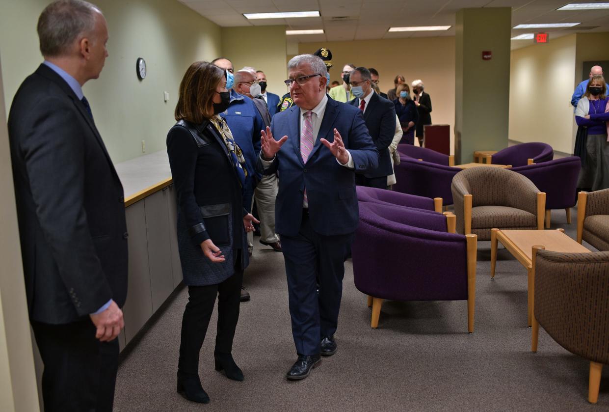 MPTC Executive Director Robert J. Ferullo Jr., center, speaks to Lt. Gov. Karyn Polito about the details of the police training center in Southbridge. Politicians, police and other guests were on hand to celebrate the opening of the facility Thursday at the Southbridge Innovation Center.