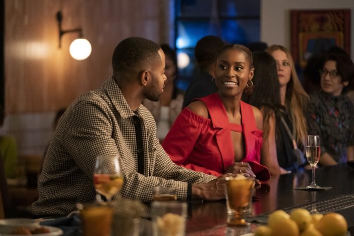 Jay Ellis (wearing an Oliver Spencer jacket) and Issa Rae (wearing a Thebe Magugu top) have high-stakes conversations in the episode.