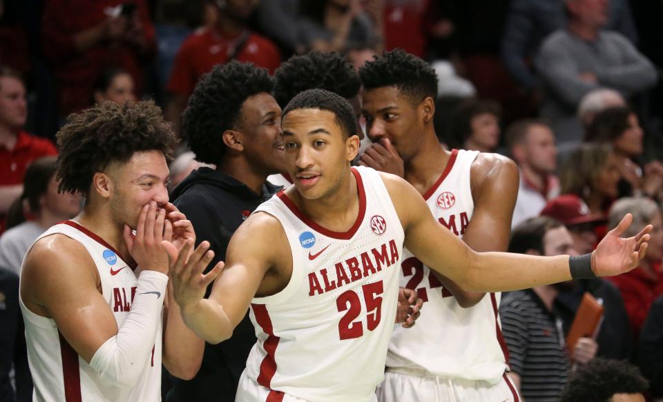 Mar 18, 2023; Birmingham, AL, USA; Alabama guard Mark Sears (1) and Alabama guard Nimari Burnett (25) enjoy the final minutes of the Crimson TideÕs win over Maryland at Legacy Arena during the second round of the NCAA Tournament. Alabama advanced to the Sweet Sixteen with a 73-51 win over Maryland. Mandatory Credit: Gary Cosby Jr.-Tuscaloosa News