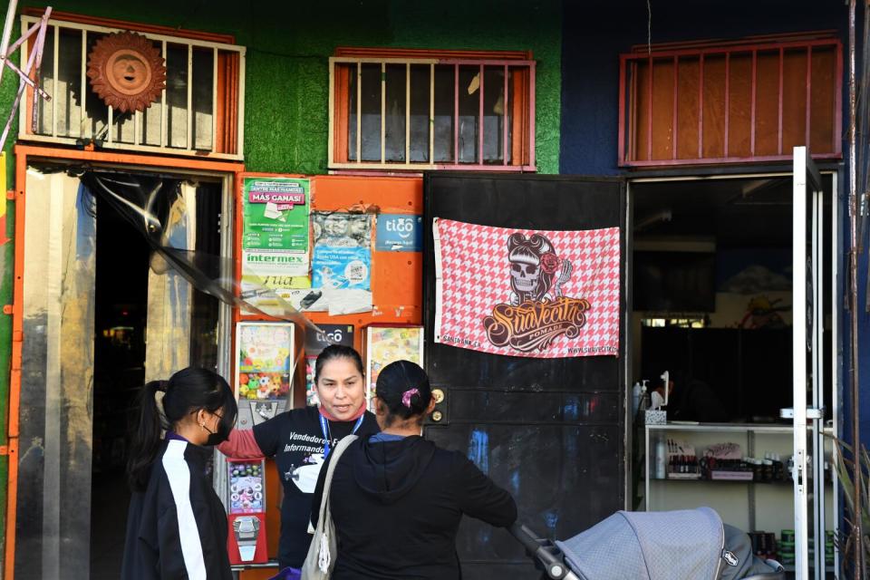 Juana Dominguez hands out information about Medi-Cal along Main Street in Los Angeles.