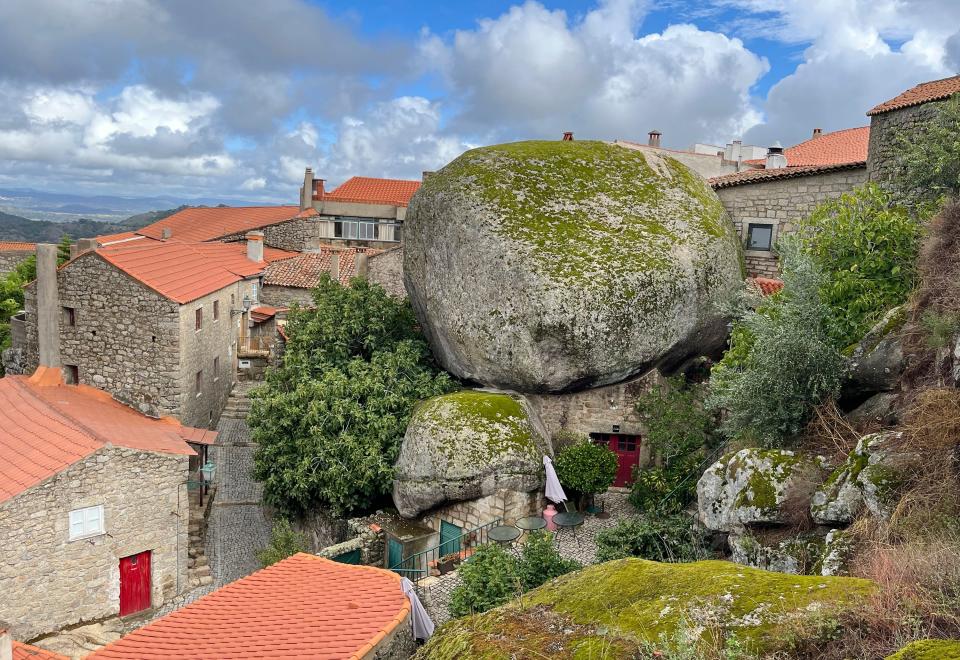 A home in the village of Monsanto, Portugal is situated around massive boulders in Monsanto, Portugal on Sept. 18, 2023. (Kristen de Groot via AP)