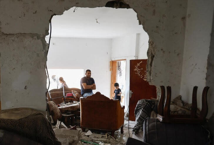 FILE PHOTO: Palestinians inspect the damage, following a several day long Israeli-raid, in Jenin camp