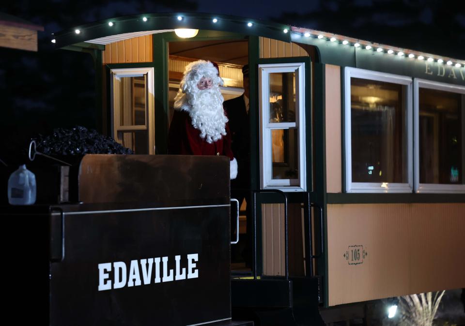 Santa arrives on a train during Edaville's "Christmas Festival of Lights" on Thursday, Nov. 10, 2022, at Edaville Family Theme Park in Carver.