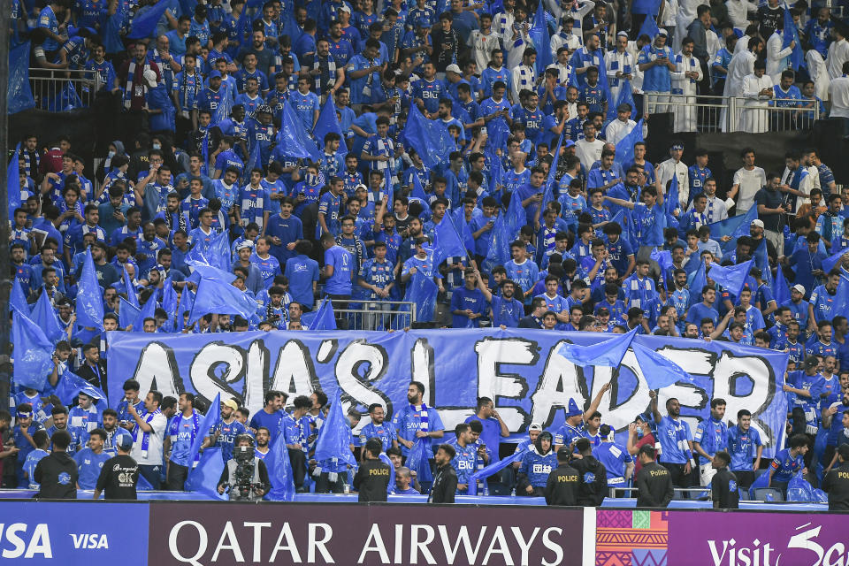 Saudi Arabia's Al Hilal fans support their team during the second leg of their AFC Champions League 2023/24 semi-final match gainst UAE's Al Ain at Kingdom Arena Stadium in Riyadh, Saudi Arabia,Tuesday, April 23, 2024. (AP Photo)