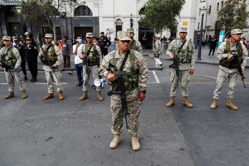 Supporters of Peru's former President Castillo gather outside the police prison where Castillo is being held, in Lima