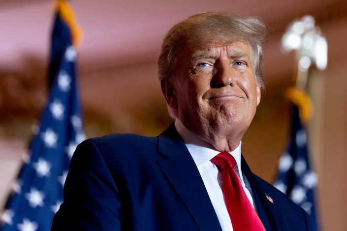 Former President Donald Trump announces he is running for president for the third time as he smiles while speaking at Mar-a-Lago in Palm Beach, Fla., Nov. 15, 2022.