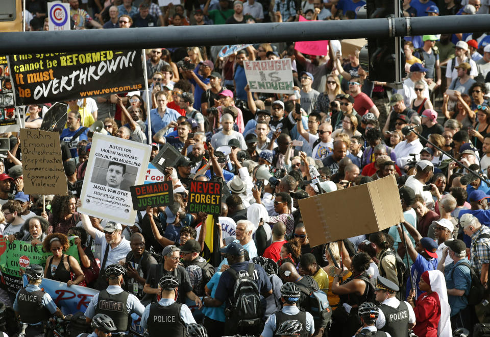 Protesters arrive at Wrigley Field to demand more government action against gun violence, Thursday, Aug. 2, 2018, in Chicago. (AP Photo/Kamil Krzaczynski)