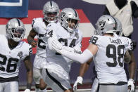 Las Vegas Raiders safety Johnathan Abram (24) celebrates his interception with teammates in the first half of an NFL football game against the New England Patriots, Sunday, Sept. 27, 2020, in Foxborough, Mass. (AP Photo/Steven Senne)