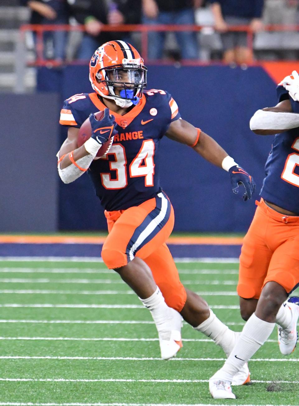 Oct 30, 2021; Syracuse, New York, USA; Syracuse Orange running back Sean Tucker (34) breaks free from the Boston College Eagles defense in the fourth quarter at the Carrier Dome. Mandatory Credit: Mark Konezny-USA TODAY Sports