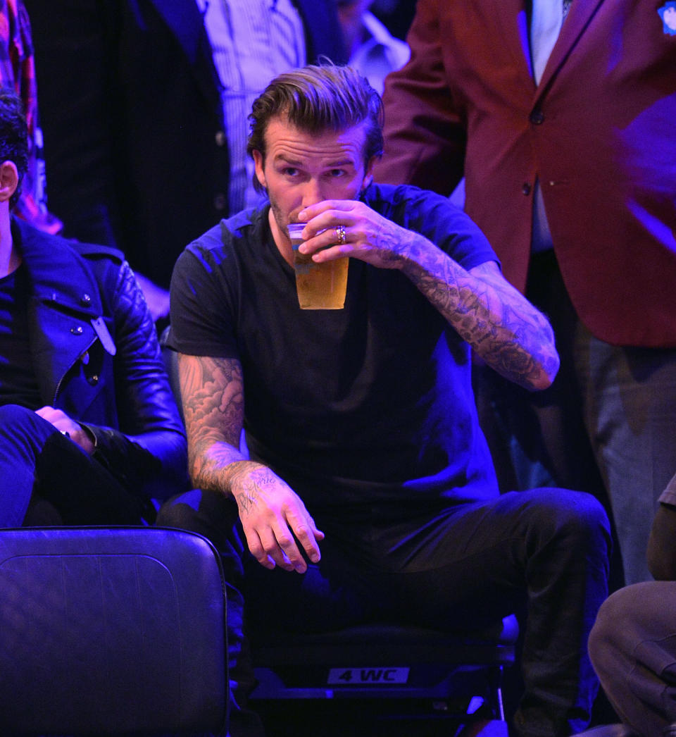 Beckham enjoying a pint at a Heat-Nets game at Barclays Center in 2013