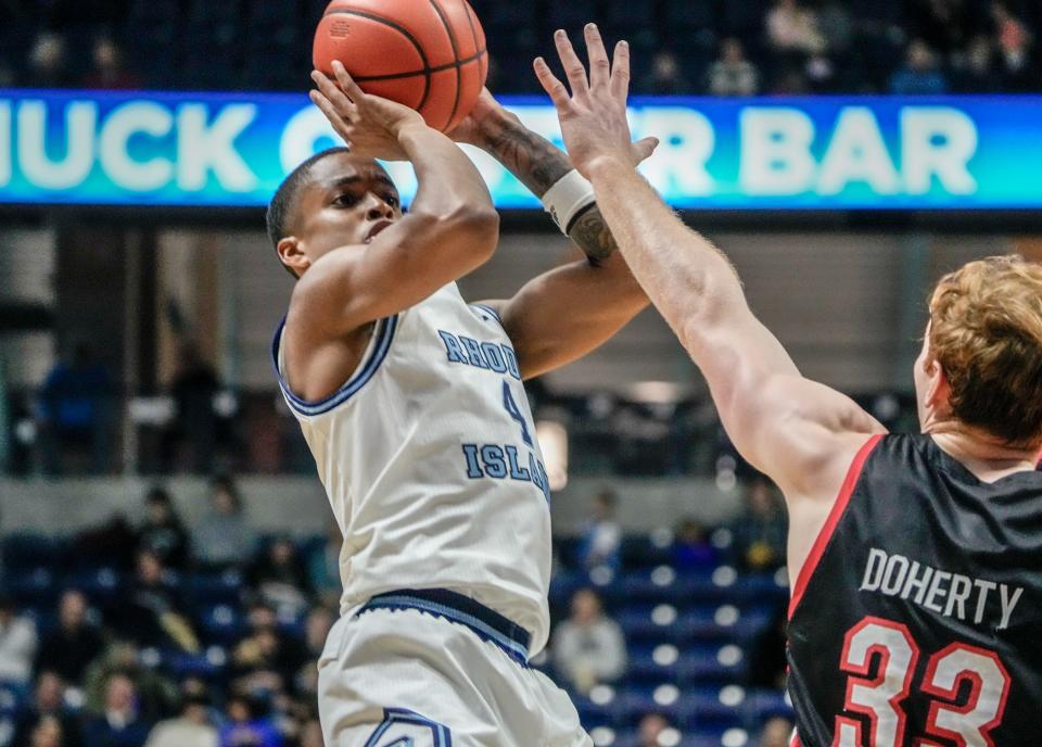 URI's Cam Estevez pulls up for a shot during the game against Northeastern on Saturday. In his first career start, he had 15 points on 6-for-12 shooting.