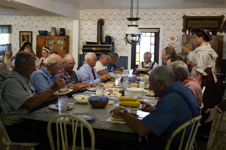 FILE - Republican presidential candidate and former Vice President Mike Pence has lunch during a stop at the Indiana State Fair, Wednesday, Aug. 2, 2023, in Indianapolis. (AP Photo/Darron Cummings, File)