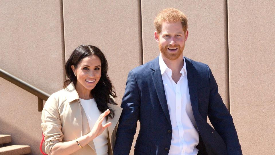 SYDNEY, AUSTRALIA - OCTOBER 16:  Prince Harry, Duke of Sussex and Meghan, Duchess of Sussex meet members of the public outside the Sydney Opera House on October 16, 2018 in Sydney, Australia. The Duke and Duchess of Sussex are on their official 16-day Autumn tour visiting cities in Australia, Fiji, Tonga and New Zealand.  (Photo by Karwai Tang/WireImage)