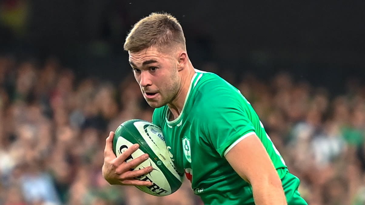  Jack Crowley of Ireland runs the ball ahead of the Ireland vs England Rugby World Cup warm-up match. 