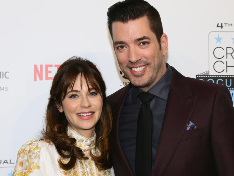 Zooey Deschanel and Jonathan Scott at a red carpet in November 2019.