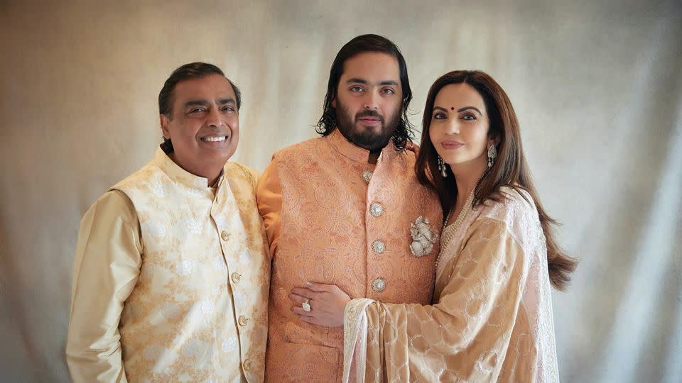 Billionaire industrialist Mukesh Ambani with his son Anant and wife Nita. - Reliance group/AP