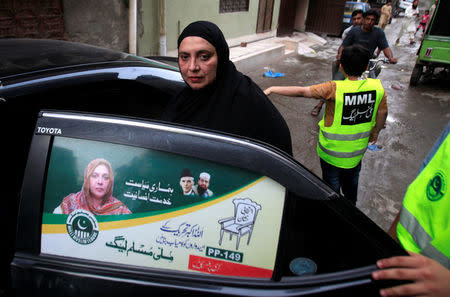 Saira Bano, nominated candidate of political party, Milli Muslim League (MML) leaves for election campaign for the Provincial Assembly PP-149 constituency in Lahore, Pakistan July 12, 2018. Picture taken July 12, 2018. REUTERS/Mohsin Raza