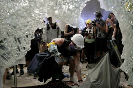 Protesters break into the Legislative Council building during the anniversary of Hong Kong's handover to China in Hong Kong