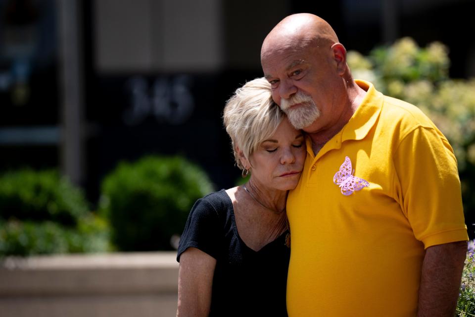 Dave Markham embraces Peggy Wallace, his fiancée, before the the John Carter sentencing for the disappearance and death of Katelyn Markham, Dave Markham’s daughter, at the Butler County Courthouse in Hamilton, Ohio, on Thursday.