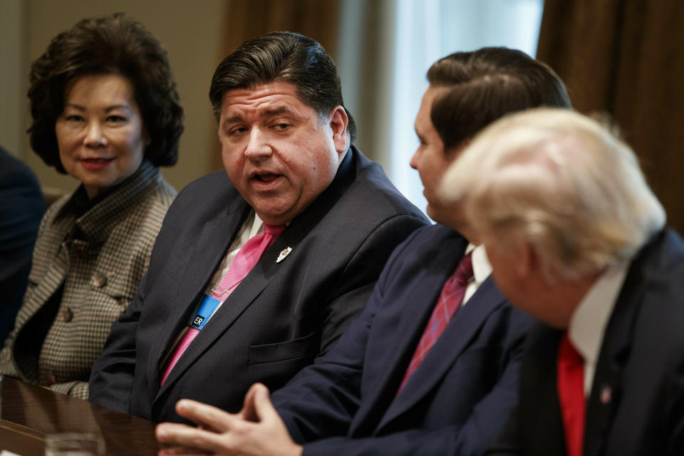 FILE--In this Dec. 13, 2018, file photo, Governor-elect J.B. Pritzker, D-Ill., center, talks with President Donald Trump during a meeting with newly elected governors in the Cabinet Room of the White House. Gubernatorial fashion in Illinois gets a lot of attention. During his first six weeks in office, Pritzker’s appointment calendar includes 70 “attire” recommendations for events as varied as bill signings, a state police officer’s funeral, a White House dinner, surveying flood damage, and cocktails with legislators at the Illinois Governor’s Mansion. (AP Photo/Evan Vucci, File)