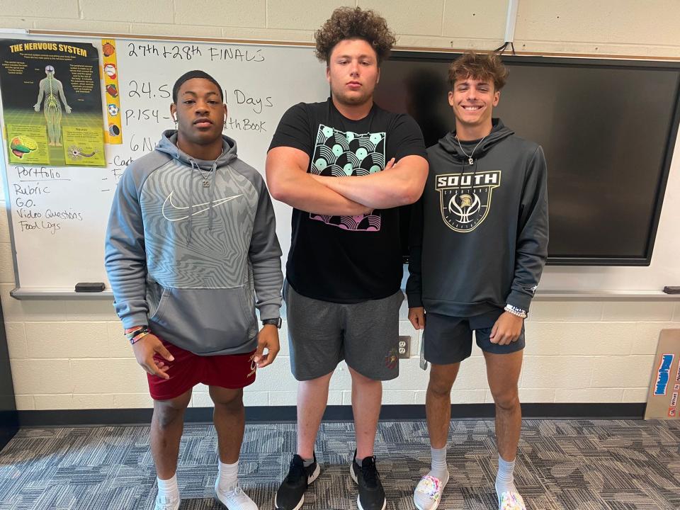 Louisville football commit Madden Sanker, middle, poses with South Paulding High School teammates Jamarion Wilcox and Kasen Weisman. Sanker pledged to the Cardinals' 2023 class on Monday, July 11, 2022.