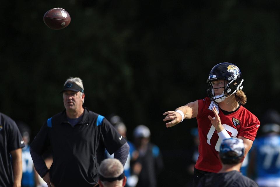 Jacksonville Jaguars quarterback Trevor Lawrence (16) throws the ball as head coach Doug Pederson looks on during day 2 of the Jaguars Training Camp Tuesday, July 26, 2022 at the Knight Sports Complex at Episcopal School of Jacksonville. [Corey Perrine/Florida Times-Union]