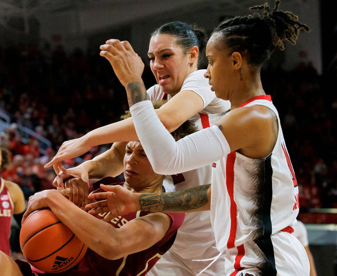 N.C. State’s Mimi Collins and Aziaha James battle for a rebound with Florida State’s Makayla Timpson during the second half of the Wolfpack’s 88-80 win on Thursday, Jan. 4, 2023, at Reynolds Coliseum in Raleigh, N.C. Kaitlin McKeown/kmckeown@newsobserver.com