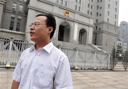 Lawyer Hao Junbo stands outside a court in Beijing, in this picture taken August 18, 2009. REUTERS/Stringer