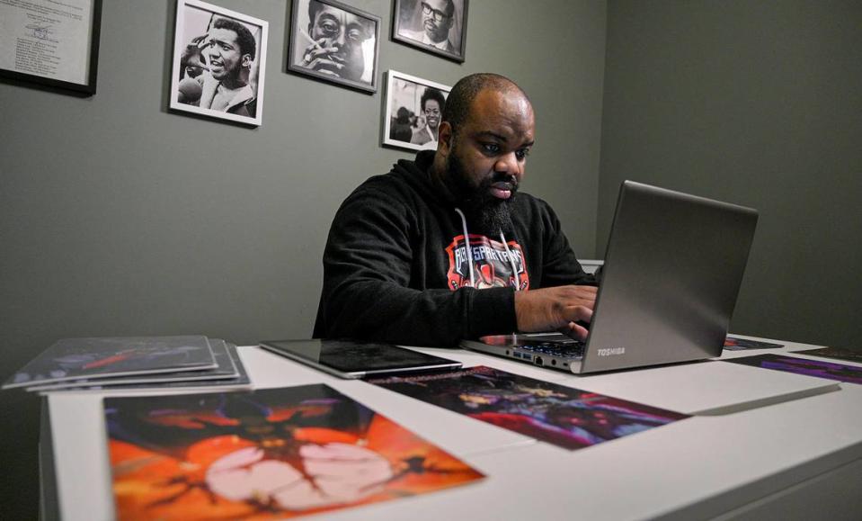Brandon Calloway works on a story for his “Black Spartans” manga series in his 31st Street office.