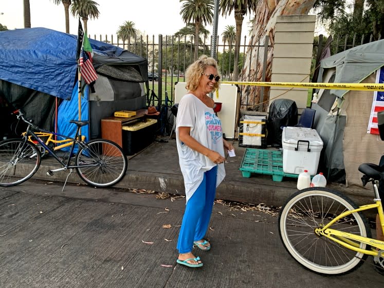 BRENTWOOD, CALIF. - SEPT. 15, 2021 - Shalise Garcia, also known as Coco, a resident of the encampment outside the grounds of the VA on San Vicente Blvd. in the Los Angeles neighborhood of Brentwood on Sept. 15, 2021, hours after a resident of the camp was fatally stabbed. (Carla Hall / Los Angeles Times)