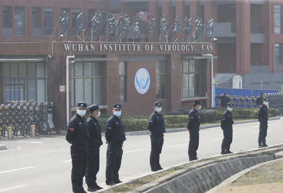 Security guard check at the gate of Wuhan Institute of Virology during coronavirus mission.