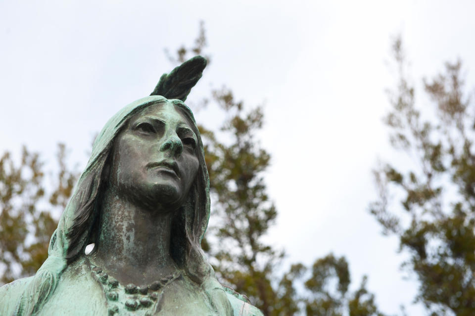 UNITED STATES -  Jan 02: Pocahontas statue at Jamestown Virginia and a memorial stone commemorates Pocahontas (c. 1595-1617), the daughter of an India