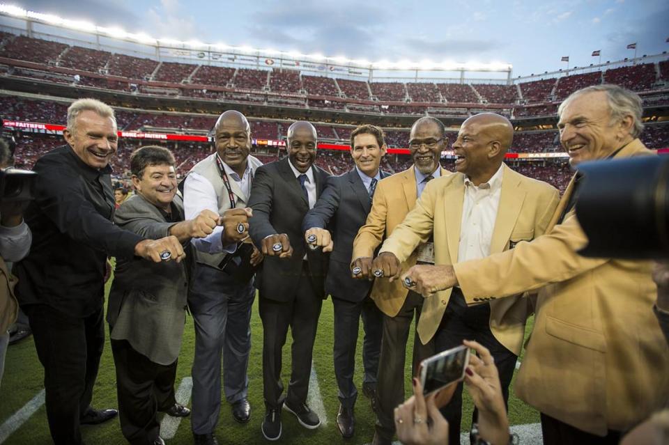 San Francisco 49ers Hall of Famers Joe Montana, former owner Eddie DeBartaolo Jr., Charles Haley, Jerry Rice, Steve Young, Jimmy Johnson, Ronnie Lott and Dave Wilcox are honored before the season-opening game at Levi’s Stadium on Sept. 14, 2015, in Santa Clara.