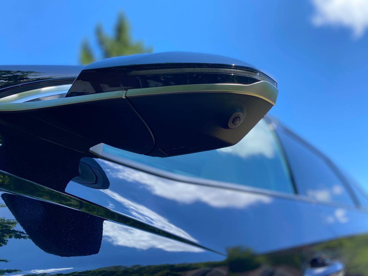 One of the 2024 Hyundai Tucson Hybrid SUV's rear-view mirror-mounted side cameras.